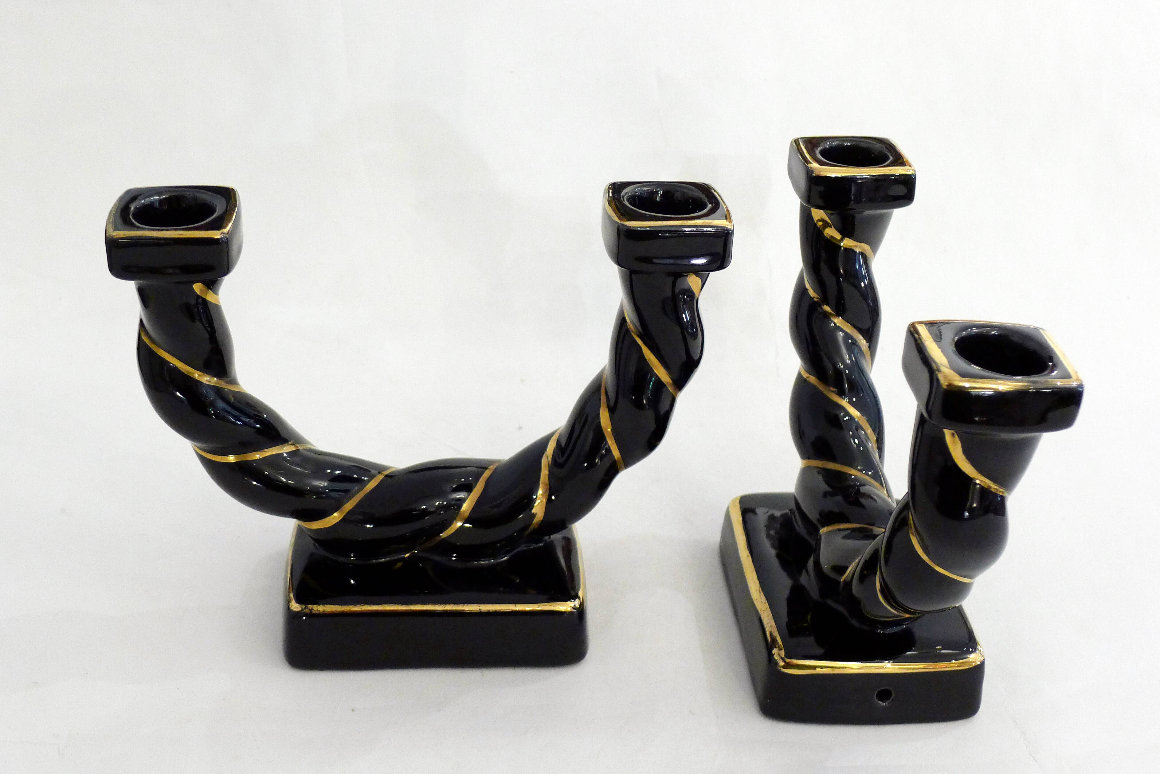 Pair of earthenware braided rope candlesticks