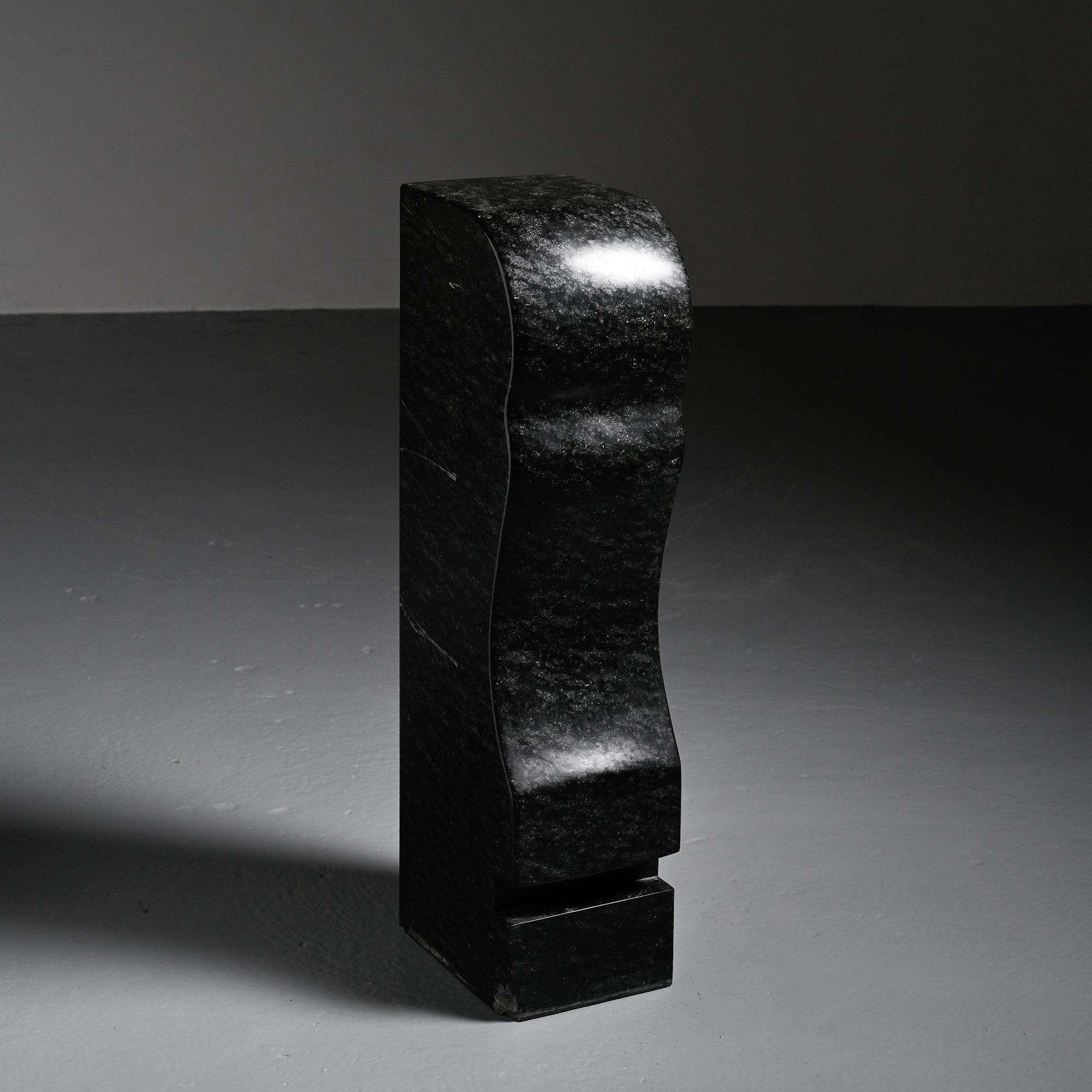 Abstract sculpture in diabase by Robert Neuhauser, Switzerland, circa 1985.