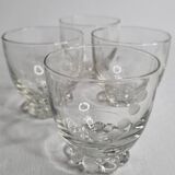 Set of four Art Deco style engraved crystal glasses on spherical feet