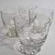 Set of four Art Deco style engraved crystal glasses on spherical feet