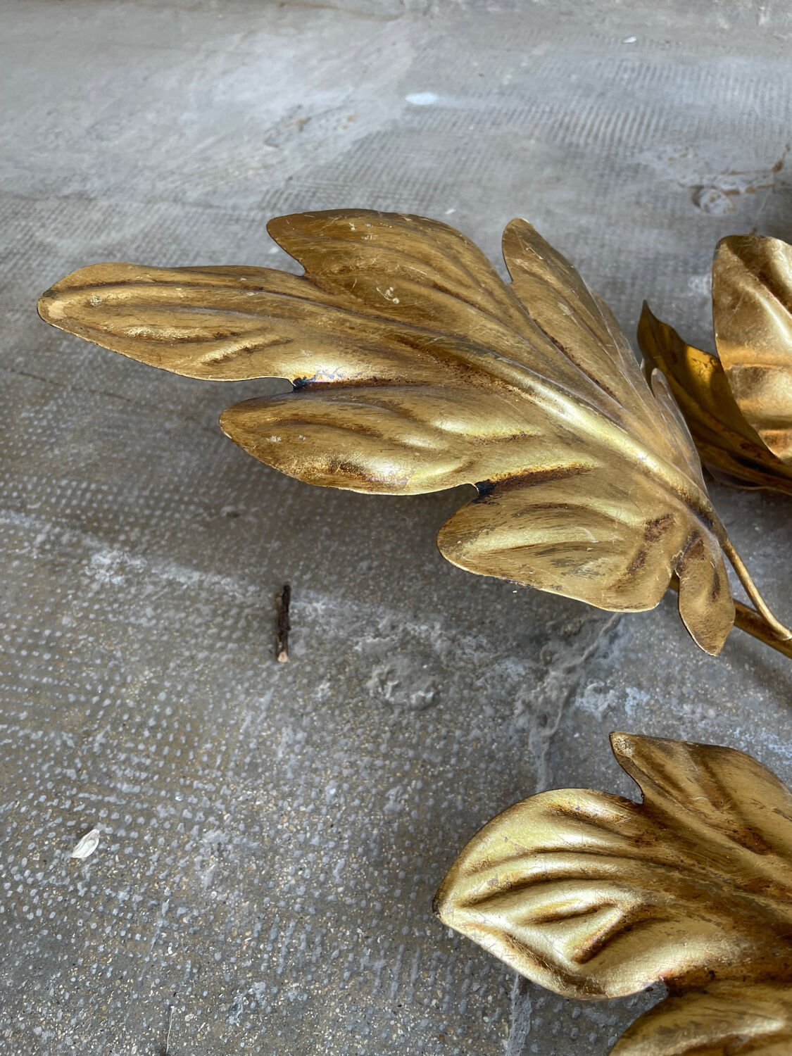 Golden wall lamp foliage