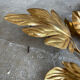Golden wall lamp foliage