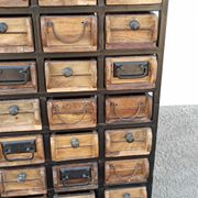 Black metal storage cabinet with 60 wooden drawers