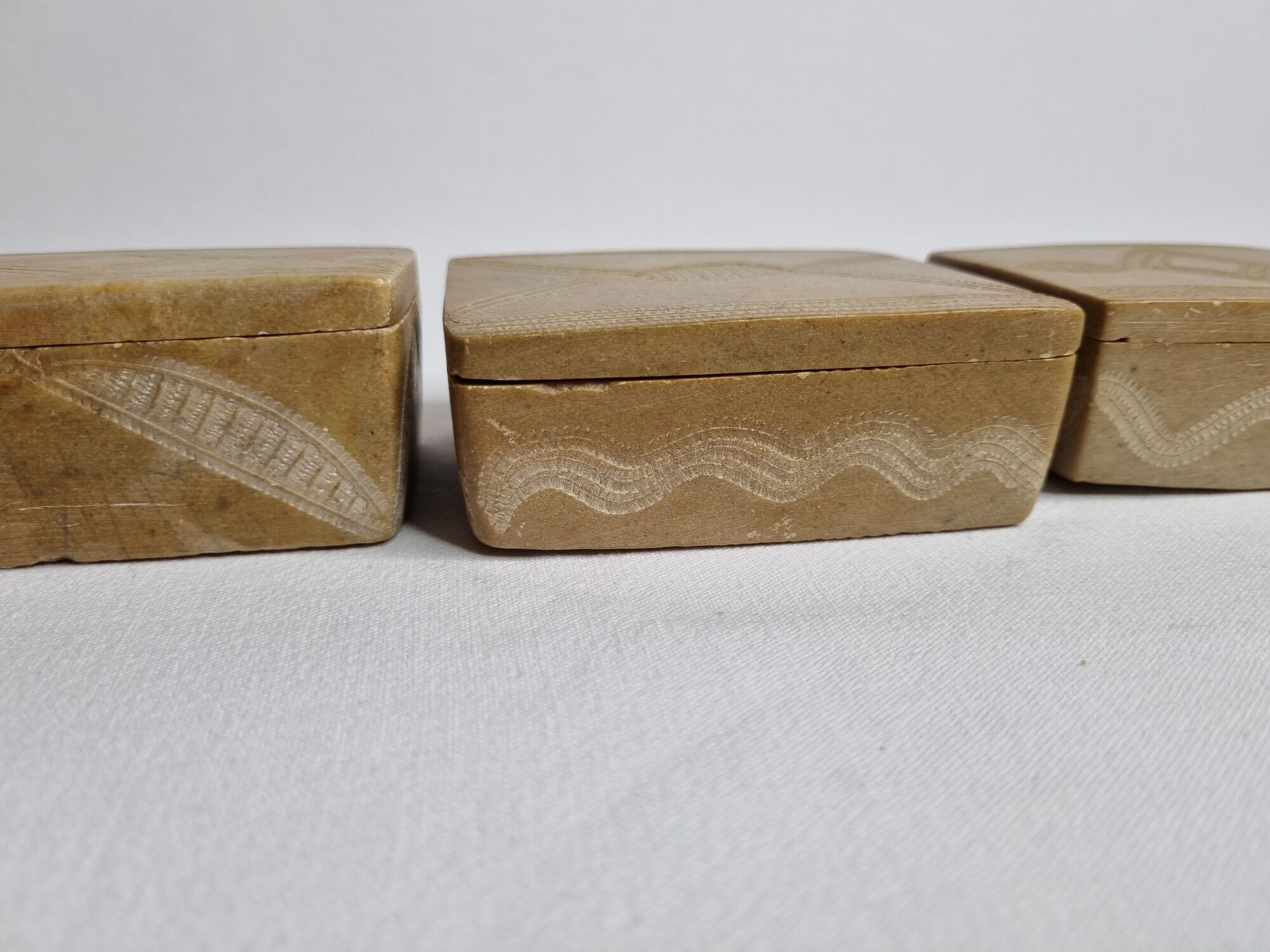 Set of three soft stone jewellery boxes decorated with traditional Tuareg motifs