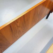 Double bed vintage modernist in teak and black metal from the 1960s with bedside tables.