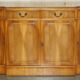 Vintage buffet made of mottled yew wood with three doors and four drawers.