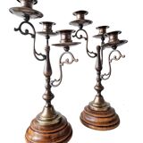 Pair of antique wooden and brass candlesticks