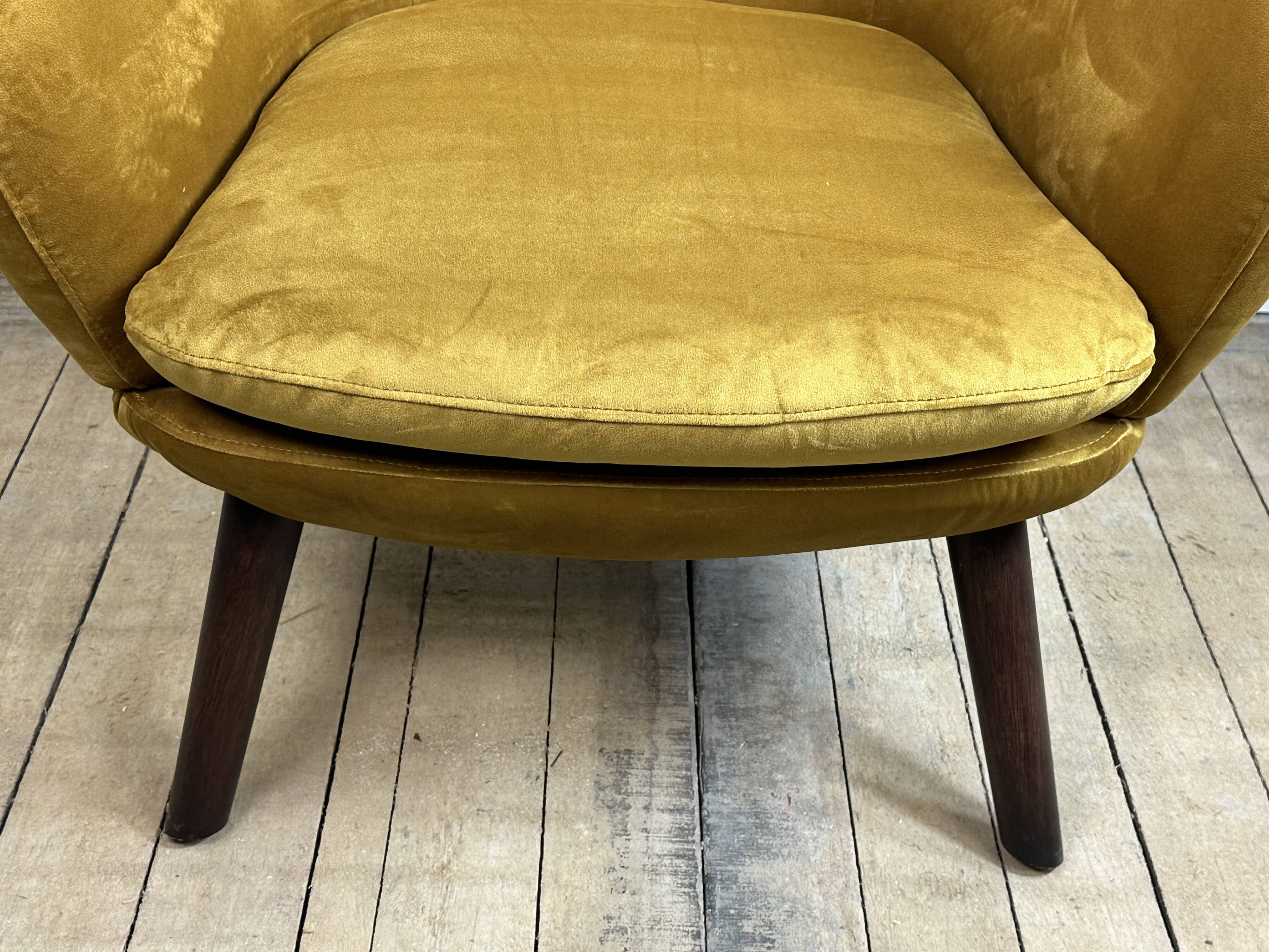 Mustard yellow velvet armchair from the 2010s.