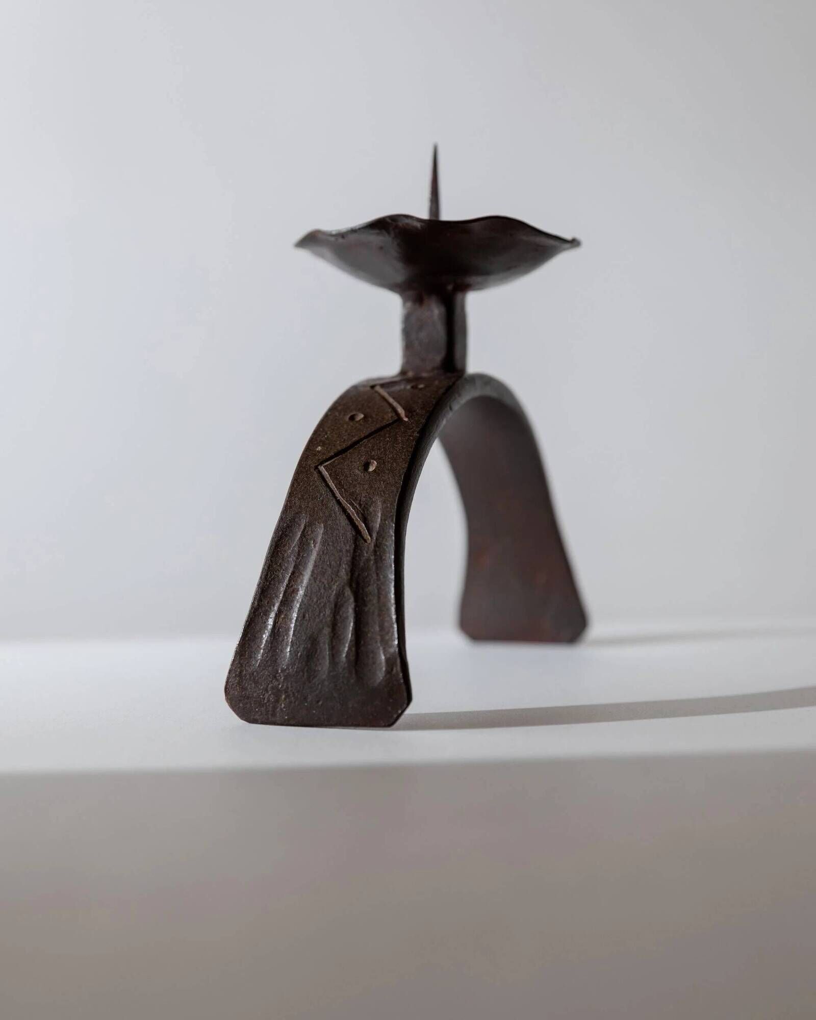 Vintage wrought iron candlestick from the 1960s, sculptural relief pattern for pillar candle, rustic Mid-Century metal, elegant gift idea.