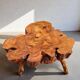 Olive root coffee table in brutalist style.