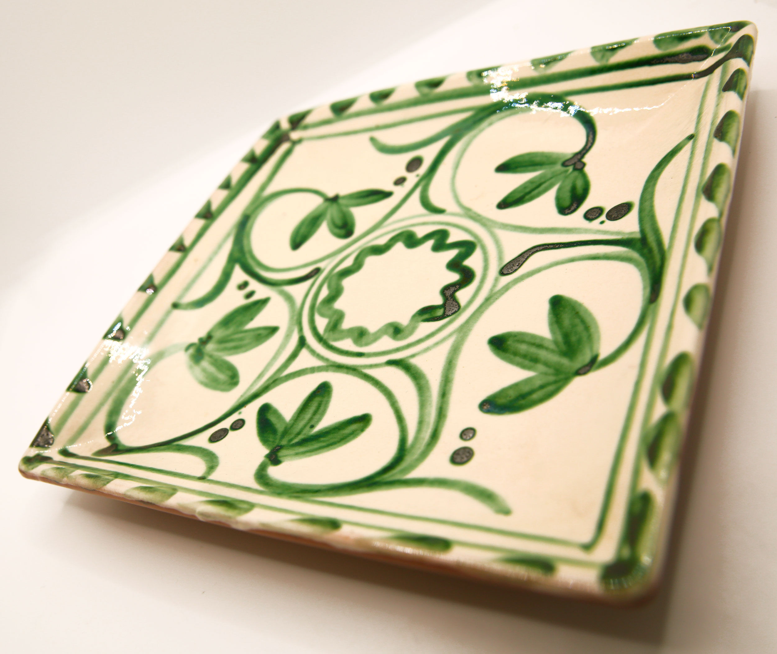 Square Mediterranean glazed earthenware dish with green flowers