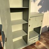 Asymmetrical vintage wardrobe painted in green.