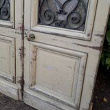 Porte d'entrée cintrée double en chêne, grilles et verre, XIXème