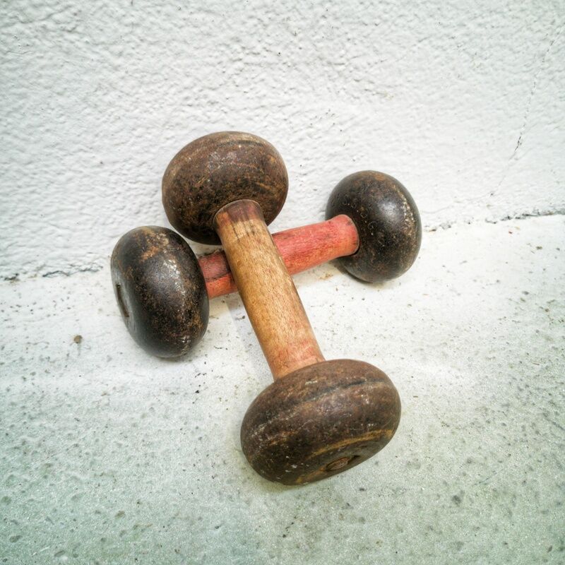 Pair of vintage dumbbells in cast iron and wood