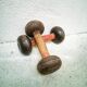 Pair of vintage dumbbells in cast iron and wood