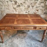 Antique French walnut table with six drawers, parquet top, early 20th century.