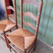 Pair of country-style straw chairs.