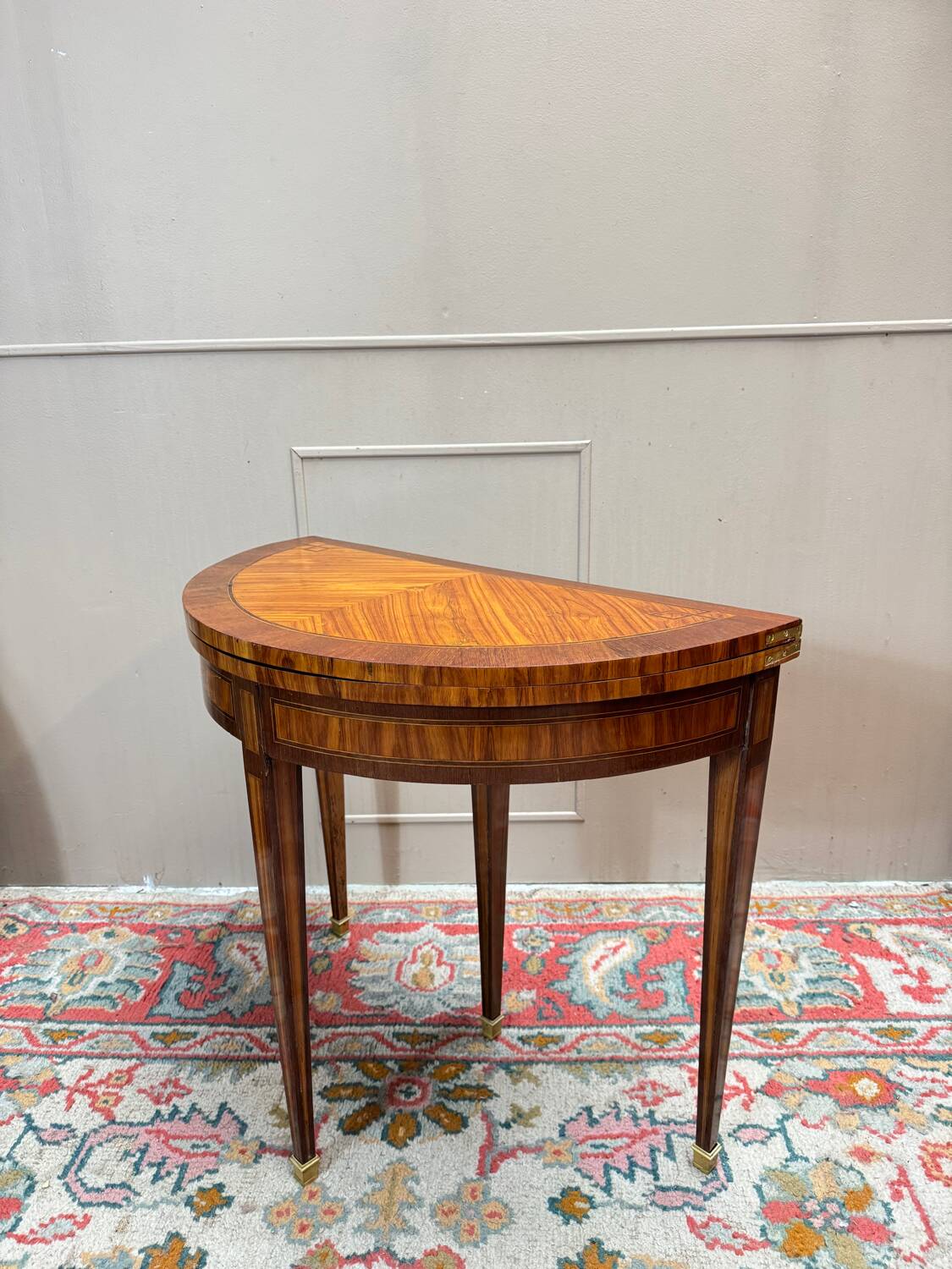 Half-moon game table in marquetry from the Louis XVI period, 18th century.