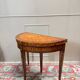 Half-moon game table in marquetry from the Louis XVI period, 18th century.