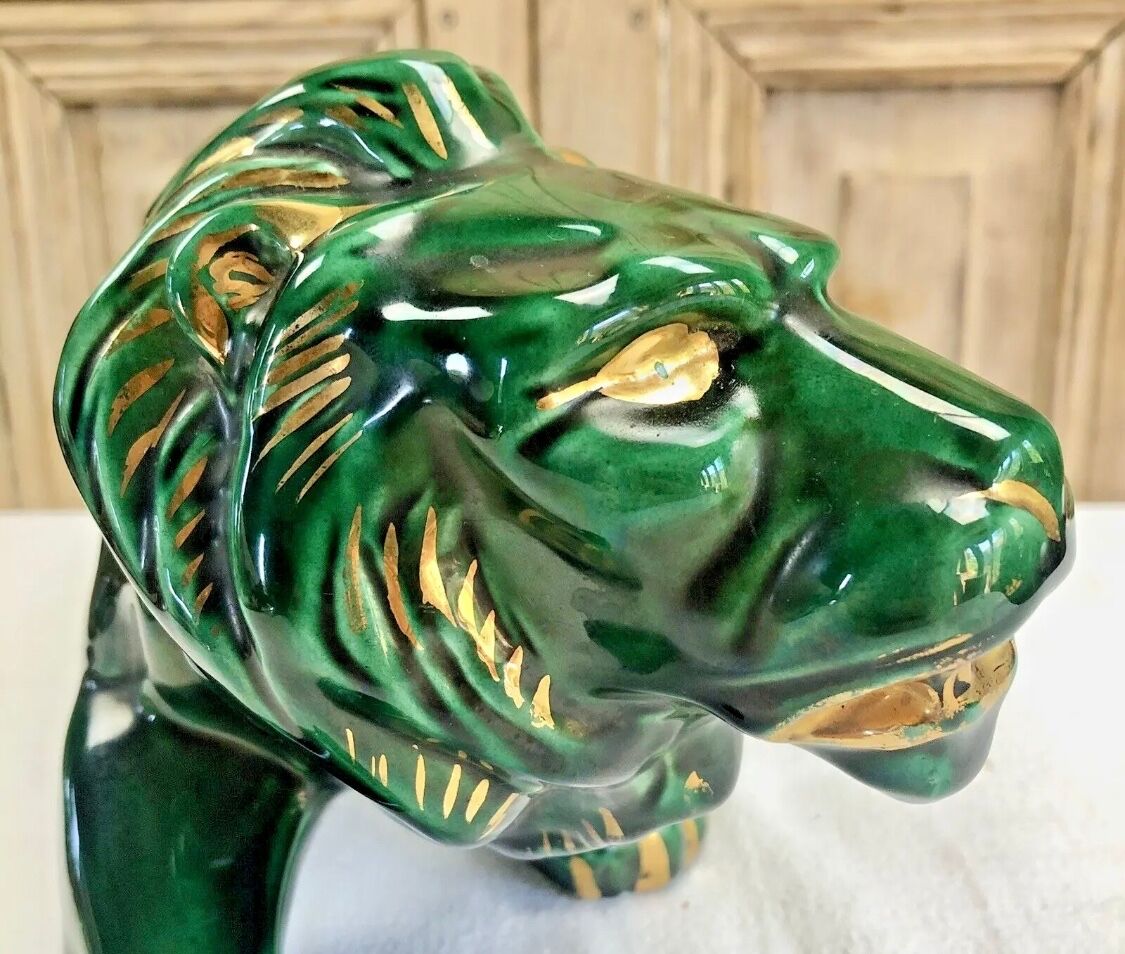 Art Deco lion statue cracked St Clement