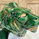 Art Deco lion statue cracked St Clement