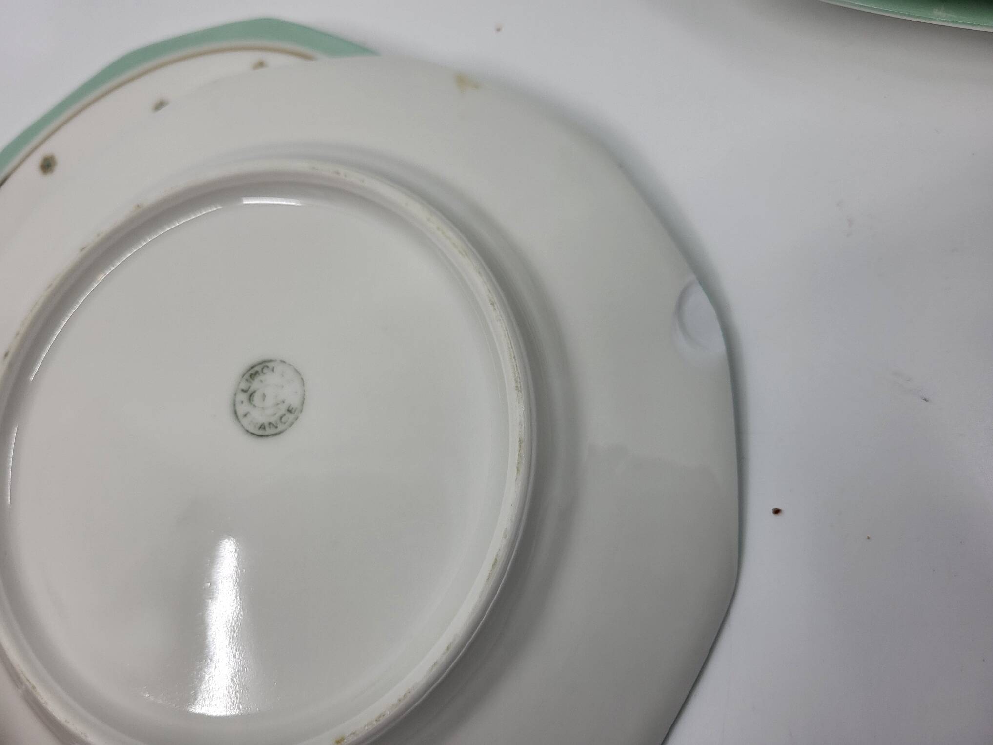 Limoges porcelain plates with green border and gold and blue flower decoration, French set of 8