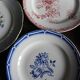 A set of 4 flat plates in pink and blue with Fontanges flowers from Sarreguemines.