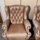 Pair of Chesterfield leather wingback armchairs