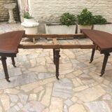 Oval table with extensions in massive mahogany napoleon III era.