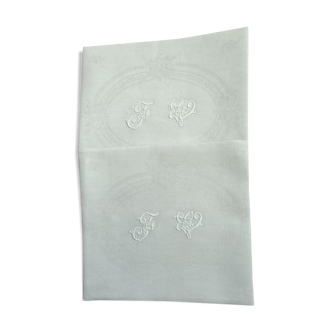 Set de 2 serviettes de table teintées vert amande monogrammées F V