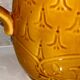 Antique pitcher with flower decoration