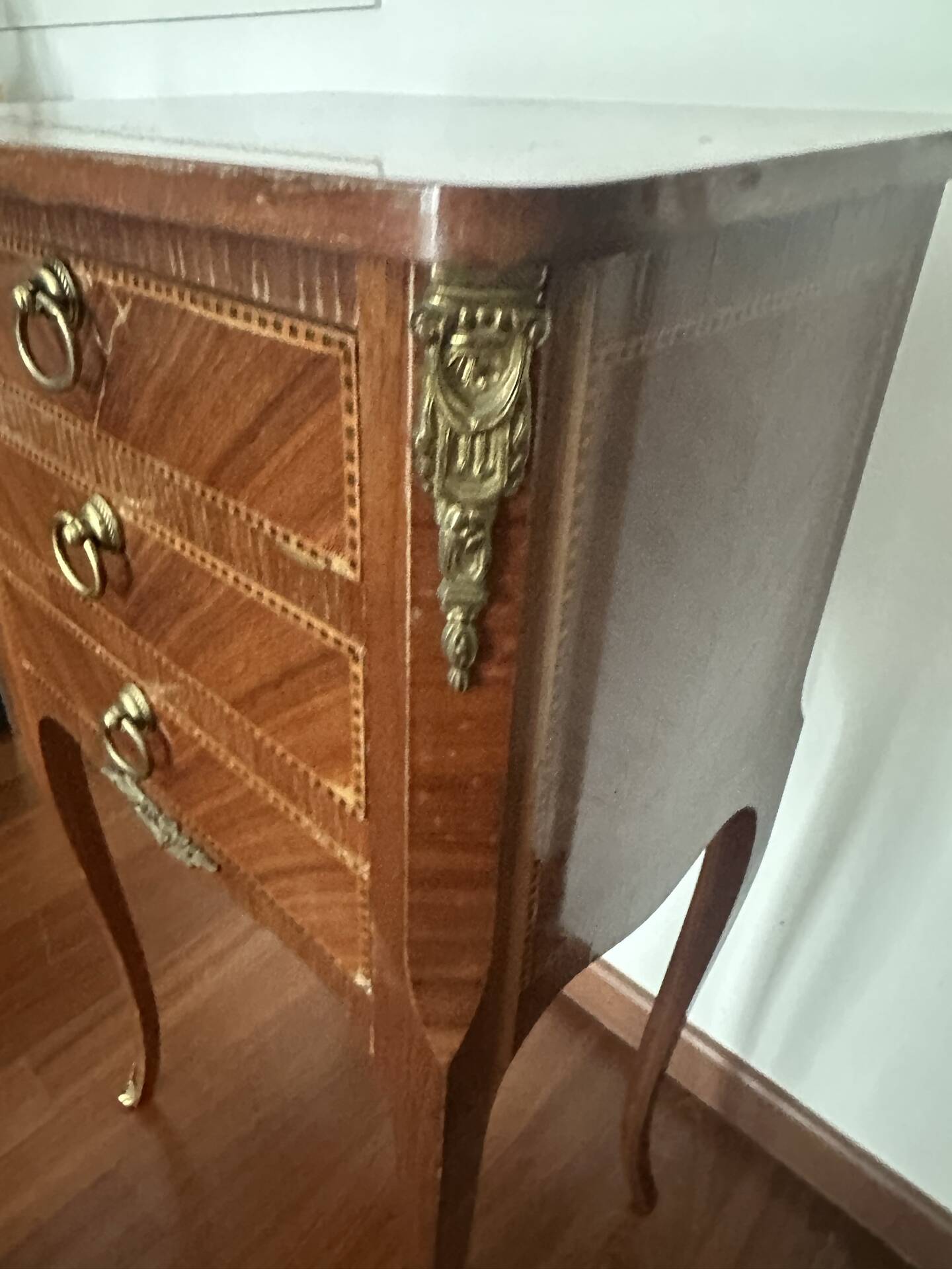 Small bedside table in marquetry in the Louis XV style.