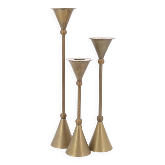 Trio of brass candlesticks, 1970s