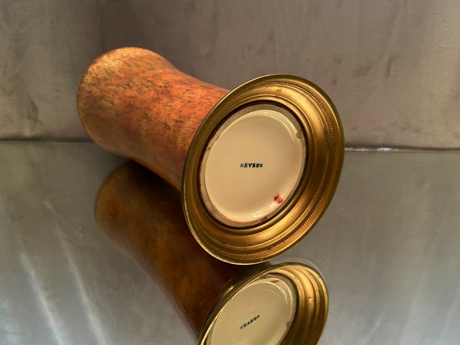 Porcelain vase signed Sèvres on bronze frame