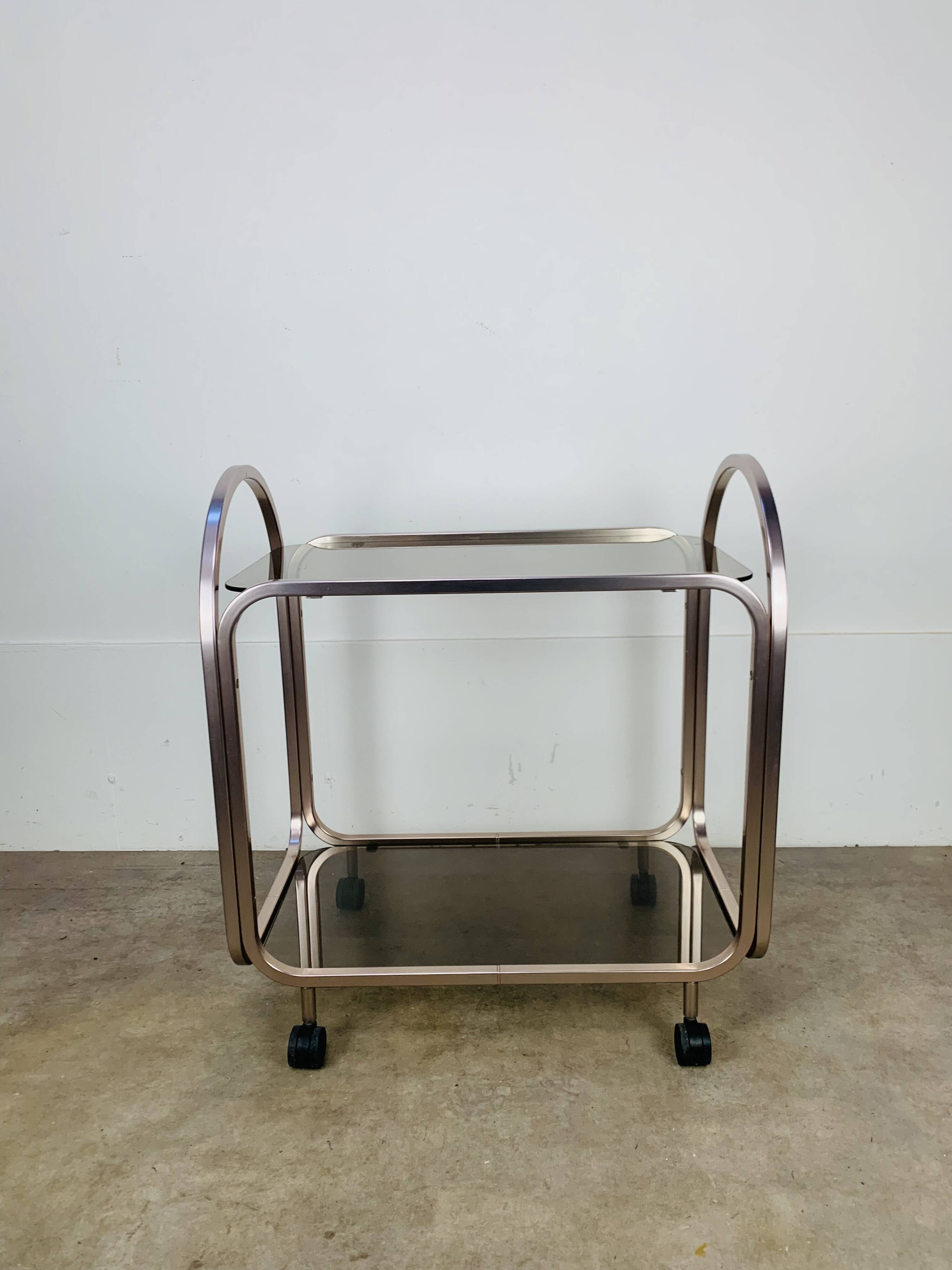 Kaymet dessert trolley in smoked glass and anodised aluminium, 1980s.