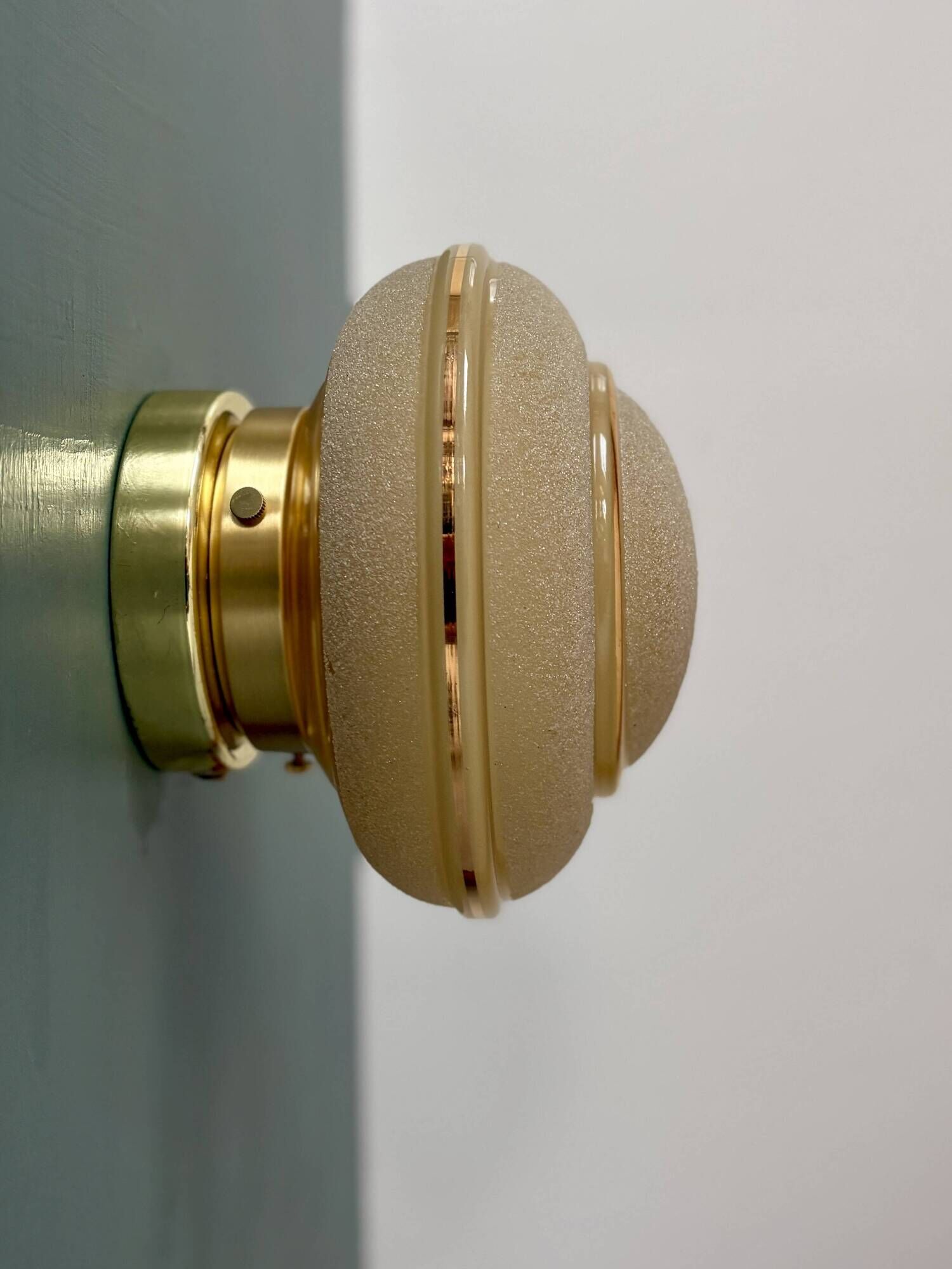 Vintage Art Deco globe wall/ceiling light in frosted yellow and gold glass.