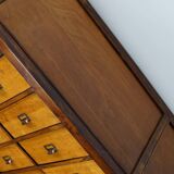 School cabinet bank of vintage Dutch drawers in mid-twentieth century pine