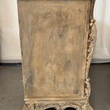 Patinated baroque crossbow chest of drawers