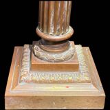 Bronze candle holder with floral motifs.