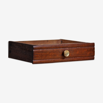Wooden drawer with gold button