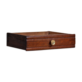 Wooden drawer with gold button