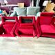 Set of 3 airborne velvet armchairs in red.