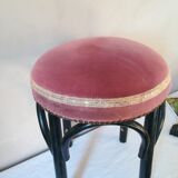 Black stool sitting in velvet rose