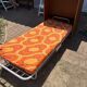Vintage foldable bedside table in zebra wood – 1970s