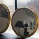 Suite of three brass mirrors
