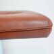 Vintage Scandinavian ottoman in brown leather with a chrome round base.