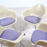 4 Eames DAX fiberglass lounge chairs with purple upholstery by Herman Mille