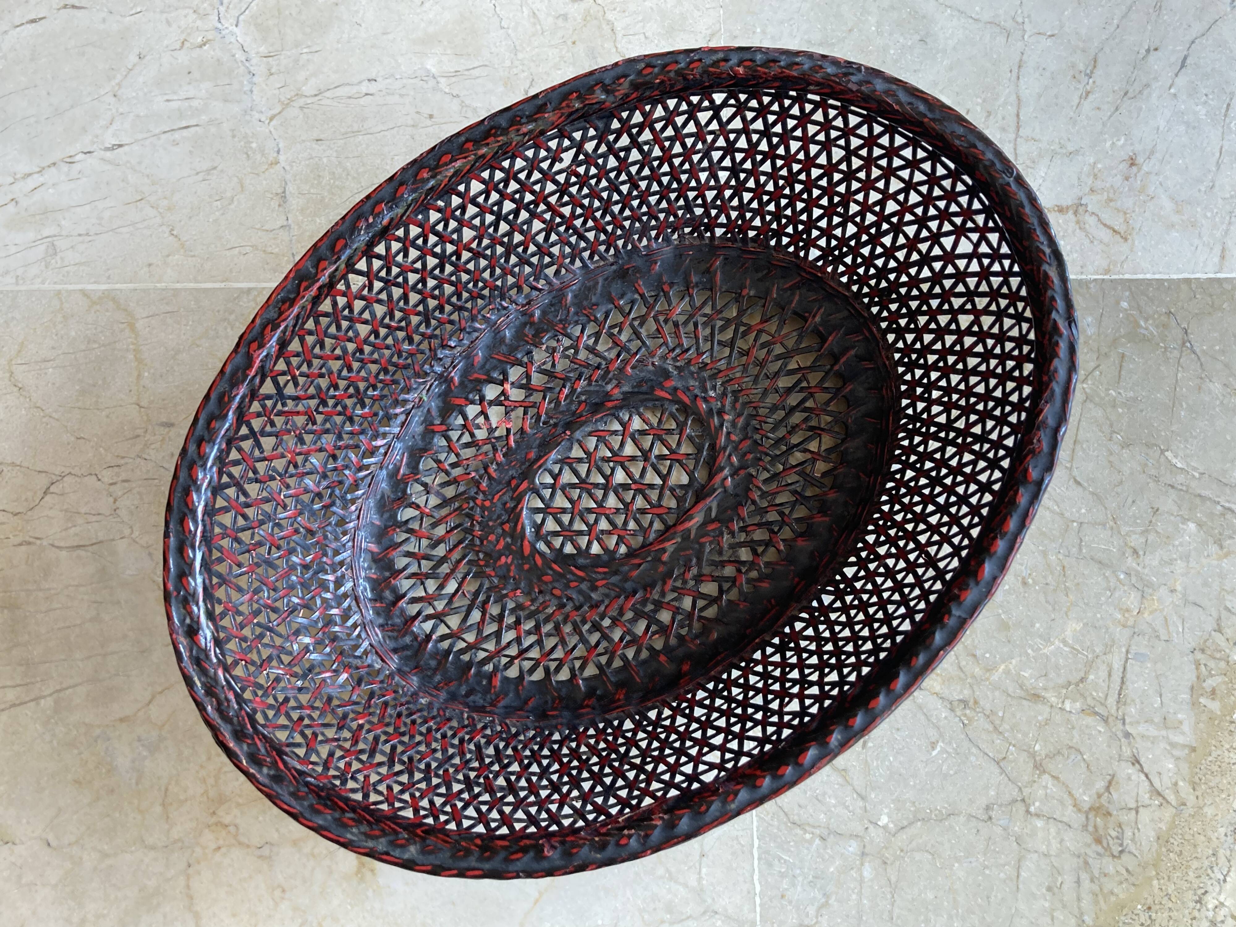 Japanese oval basket in negoro lacquered basketry (red lacquer on black background)