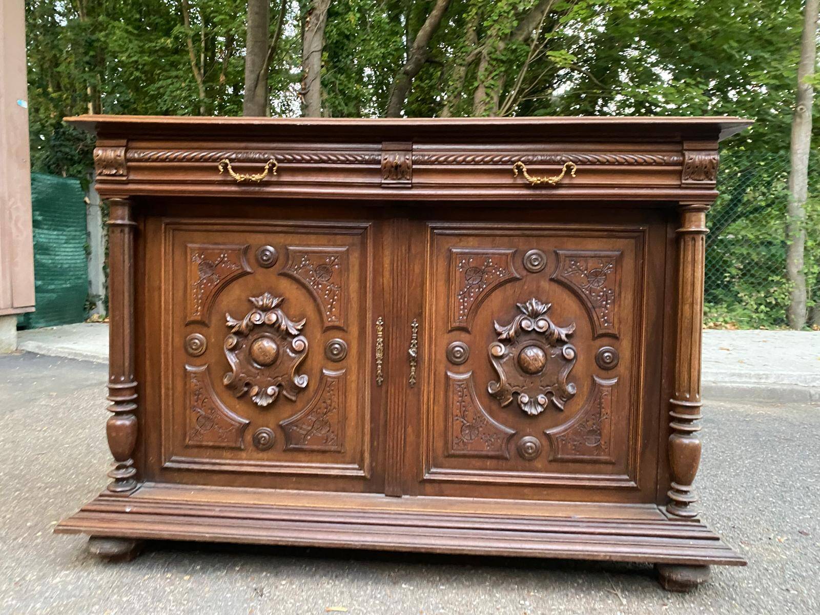 Henri II sideboard in carved wood, 1930.