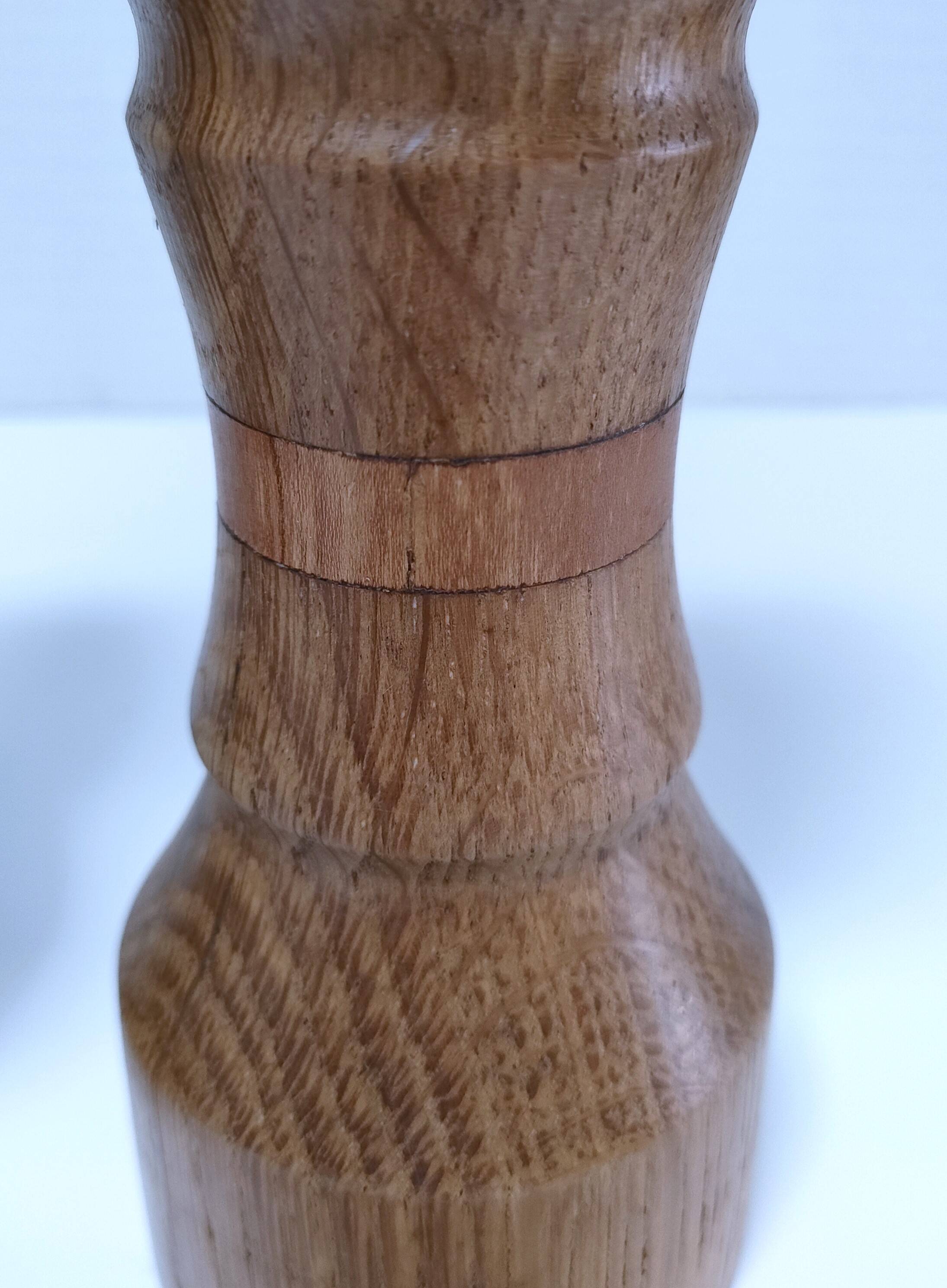 Three vintage patinated solid wood candlesticks
